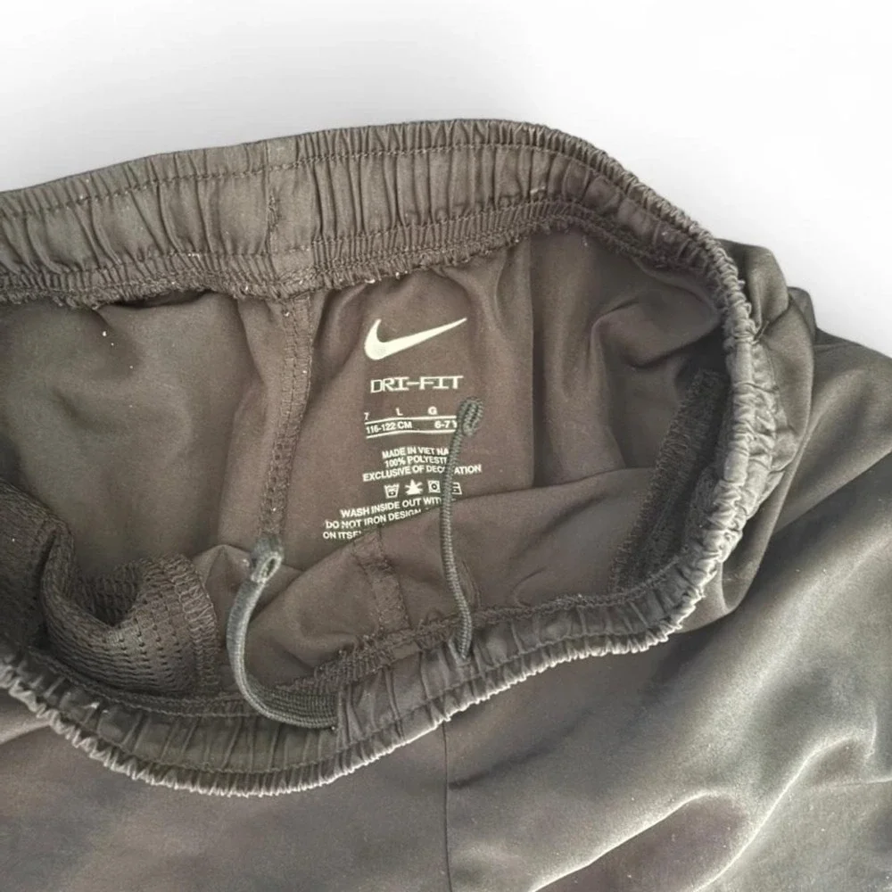 Nike Black running shorts kids size 7‎